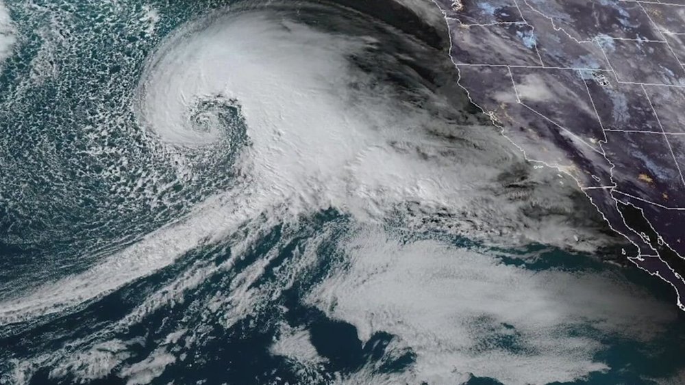 Satellite Image of Cyclone next to map of west coast 