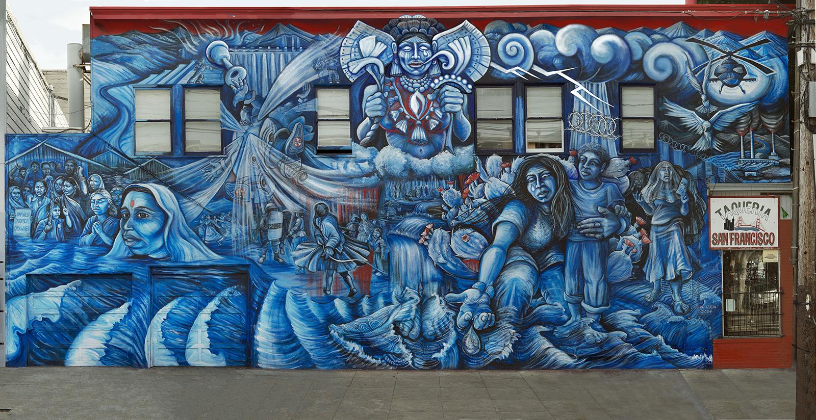 A mural is painted in primarily reds and blues depicting women and resistance.
